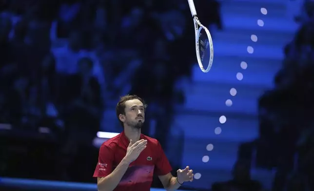 Russia's Daniil Medvedev reacts during the singles tennis match of the ATP World Tour Finals against United States' Taylor Fritz, at the Inalpi Arena, in Turin, Italy, Sunday, Nov. 10, 2024. (AP Photo/Antonio Calanni)