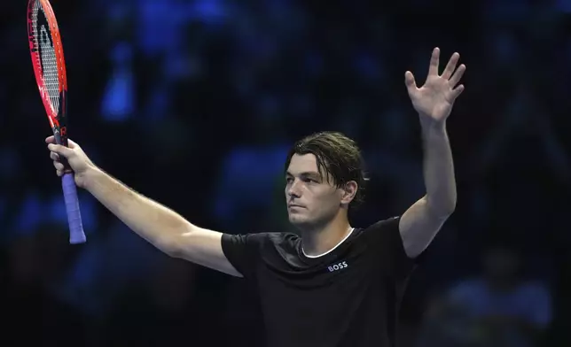 United States' Taylor Fritz celebrates after winning against Russia's Daniil Medvedev the singles tennis match of the ATP World Tour Finals at the Inalpi Arena, in Turin, Italy, Sunday, Nov. 10, 2024. (AP Photo/Antonio Calanni)