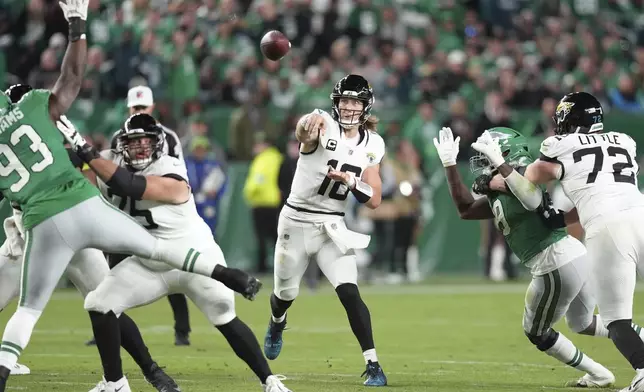 Jacksonville Jaguars quarterback Trevor Lawrence (16) throws during the second half of an NFL football game against the Philadelphia Eagles on Sunday, Nov. 3, 2024, in Philadelphia. (AP Photo/Chris Szagola)