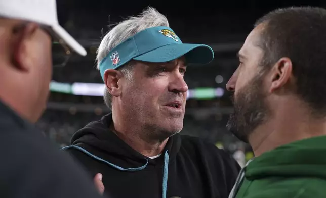 Jacksonville Jaguars head coach Doug Pederson and Philadelphia Eagles head coach Nick Sirianni, right, talk after NFL football game Sunday, Nov. 3, 2024, in Philadelphia. (AP Photo/Matt Slocum)