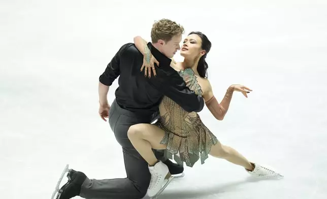 Madison Chock and Evan Bates of the U.S. compete in the ice dance free dance at the Grand Prix of Figure Skating series competition in Tokyo, Saturday, Nov. 9, 2024. (AP Photo/Hiro Komae)