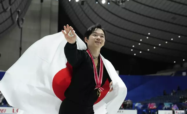 Gold medalist Yuma Kagiyama of Japan, celebrates after competing the men's free skating at the Grand Prix of Figure Skating series competition in Tokyo, Saturday, Nov. 9, 2024. (AP Photo/Hiro Komae)