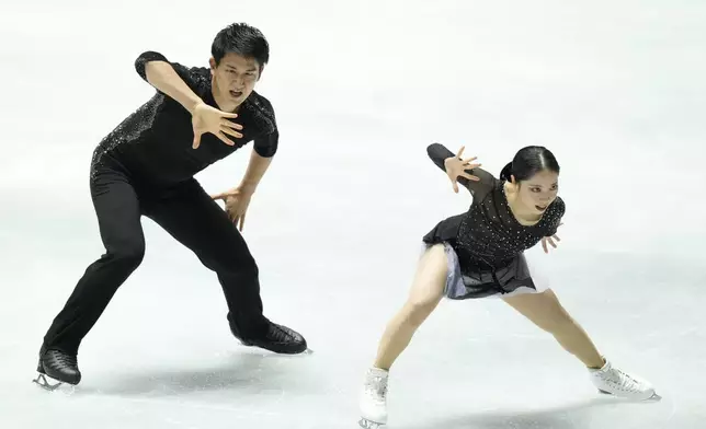 Riku Miura and Ryuichi Kihara of Japan compete in the pairs short program at the Grand Prix of Figure Skating series competition in Tokyo, Japan, Friday, Nov. 8, 2024. (AP Photo/Hiro Komae)