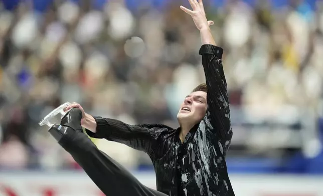 Andrew Torgashev of the U.S. competes in the men's short program at the Grand Prix of Figure Skating series competition in Tokyo, Japan, Friday, Nov. 8, 2024. (AP Photo/Hiro Komae)