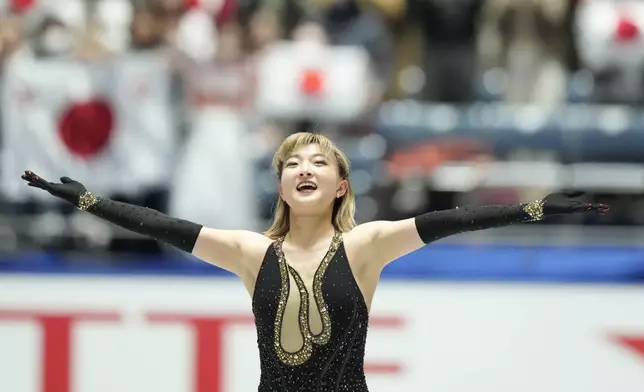 Kaori Sakamoto of Japan reacts after competing the women's free skating at the Grand Prix of Figure Skating series competition in Tokyo, Saturday, Nov. 9, 2024. (AP Photo/Hiro Komae)