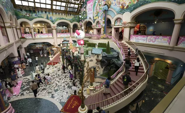 Hello Kitty fans visit Sanrio Puroland to celebrate its best known character's 50th birth anniversary, in Tama, a western suburb of Tokyo, Japan, Friday, Nov. 1, 2024. (AP Photo/Hiro Komae)