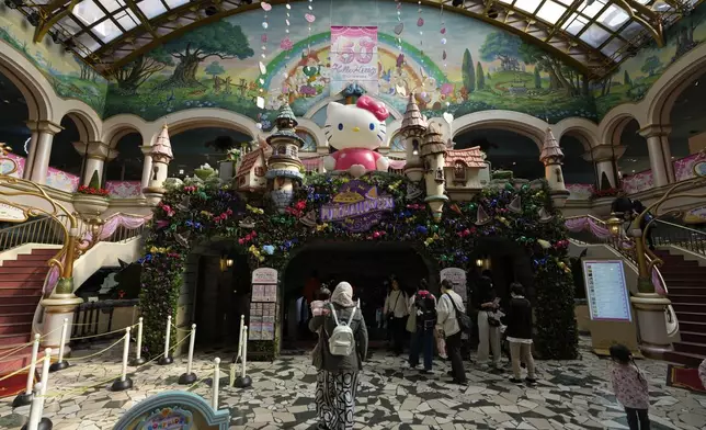 A Hello Kitty figure welcomes visitors at Sanrio Puroland during her 50th birth anniversary celebrations in Tama, a western suburb of Tokyo, Japan, Friday, Nov. 1, 2024. (AP Photo/Hiro Komae)
