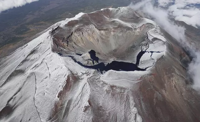 Mt. Fuji in Japan is covered with snow Wednesday, Nov. 6, 2024. (Kyodo News via AP)