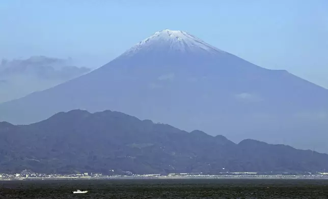 Mt. Fuji is snowcapped, seen from Shizuoka prefecture, central Japan Wednesday, Nov. 6, 2024. (Kyodo News via AP)