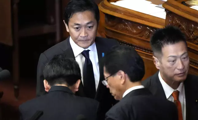 Yuichiro Tamaki, leader of the Democratic Party for the People, makes a parliamentary vote for a new leader during a special parliamentary session of the lower house, Monday, Nov. 11, 2024, in Tokyo. (AP Photo/Eugene Hoshiko)