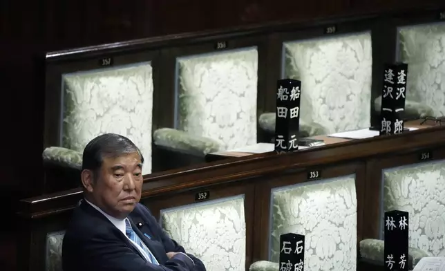 Japanese Prime Minister Shigeru Ishiba waits after the first vote for a new prime minister at a special parliamentary session of the lower house Monday, Nov. 11, 2024, in Tokyo. (AP Photo/Eugene Hoshiko)