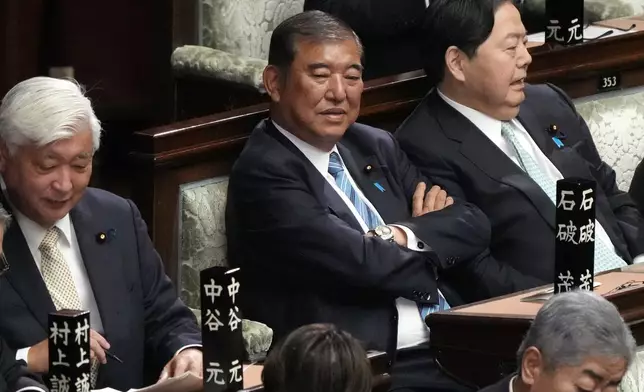 Japanese Prime Minister Shigeru Ishiba, center, attends a special parliamentary session of the lower house before a parliamentary vote for a new leader Monday, Nov. 11, 2024, in Tokyo. (AP Photo/Eugene Hoshiko)