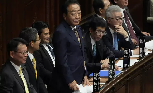 Yoshihiko Noda, center, head of the Constitutional Democratic Party of Japan, attends a special parliamentary session of the lower house for parliamentary voting for a new leader, Monday, Nov. 11, 2024, in Tokyo. (AP Photo/Eugene Hoshiko)