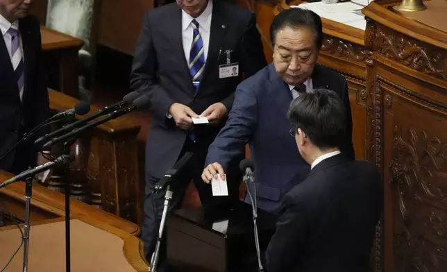 Yoshihiko Noda, leader of the Constitutional Democratic Party, votes for the new prime minister at the parliament's lower house Monday, Nov. 11, 2024, in Tokyo. (AP Photo/Eugene Hoshiko)