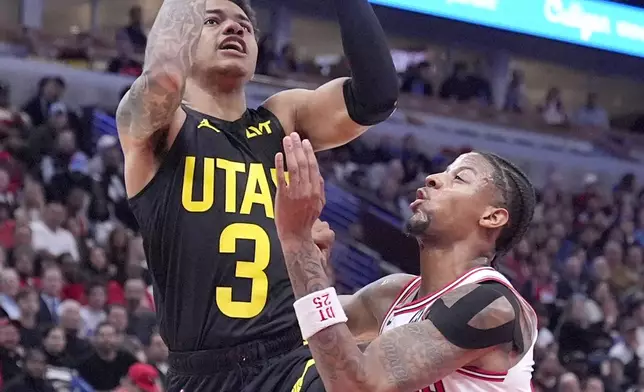 Utah Jazz's Keyonte George (3) shoots over Chicago Bulls' Dalen Terry during the second half of an NBA basketball game Monday, Nov. 4, 2024, in Chicago. (AP Photo/Charles Rex Arbogast)