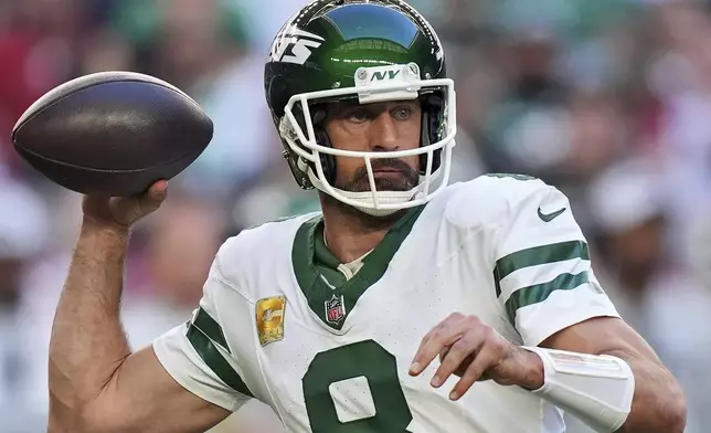 New York Jets quarterback Aaron Rodgers throws against the Arizona Cardinals during the first half of an NFL football game, Sunday, Nov. 10, 2024, in Glendale, Ariz. (AP Photo/Brynn Anderson)