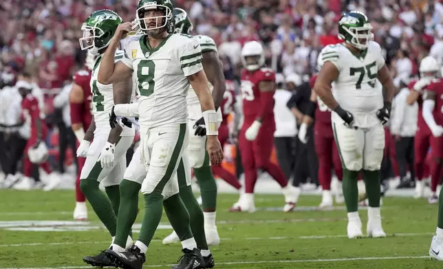 New York Jets quarterback Aaron Rodgers (8) walks the the sidelines during the second half of an NFL football game against the Arizona Cardinals, Sunday, Nov. 10, 2024, in Glendale, Ariz. (AP Photo/Ross D. Franklin)