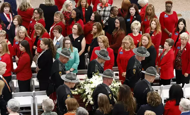 Members of the Ohio State Highway Patrol carry the casket for former Ohio House speaker Jo Ann Davidson into the atrium of the Ohio Statehouse for her funeral in Columbus, Ohio, Thursday, Oct. 31, 2024. (AP Photo/Paul Vernon)