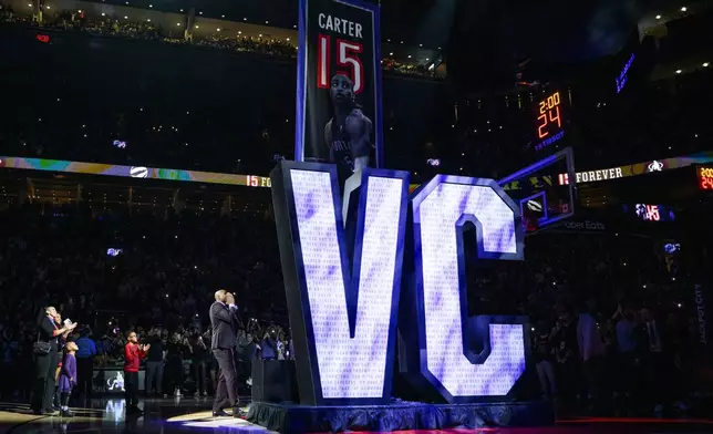 Former Toronto Raptors player Vince Carter reacts during his number retirement ceremony at halftime of an NBA basketball game between the Toronto Raptors and the Sacramento Kings in Toronto on Saturday, Nov. 2, 2024. (Christopher Katsarov/The Canadian Press via AP)