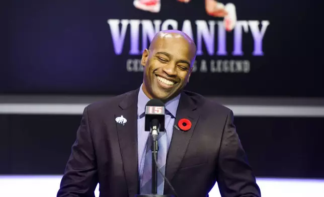 Former Toronto Raptors player Vince Carter speaks to media ahead of his number retirement, before an NBA basketball game between the Toronto Raptors and the Sacramento Kings at the Scotiabank arena in Toronto on Saturday, Nov. 2, 2024. (Christopher Katsarov/The Canadian Press via AP)