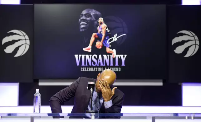 Former Toronto Raptors player Vince Carter speaks to media ahead of his number retirement, before an NBA basketball game between the Toronto Raptors and the Sacramento Kings at the Scotiabank arena in Toronto on Saturday, Nov. 2, 2024. (Christopher Katsarov/The Canadian Press via AP)