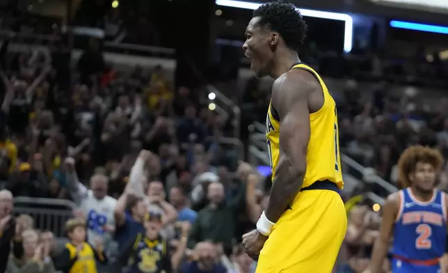 Indiana Pacers' Bennedict Mathurin reacts after hitting a basket and getting fouled during the second half of an NBA basketball game against the New York Knicks, Sunday, Nov. 10, 2024, in Indianapolis. (AP Photo/Darron Cummings)