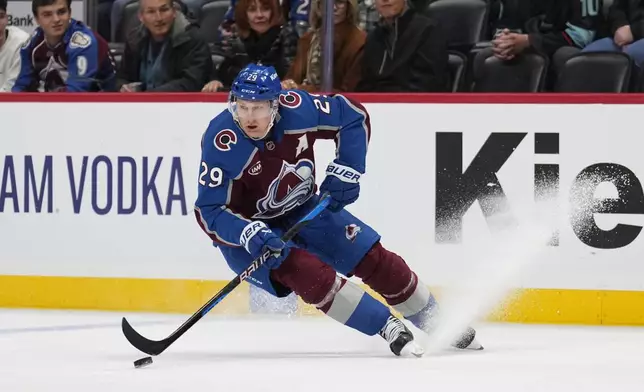 Colorado Avalanche center Nathan MacKinnon skates against the Seattle Kraken during the third period of an NHL hockey game Tuesday, Nov. 5, 2024, in Denver. (AP Photo/Jack Dempsey)