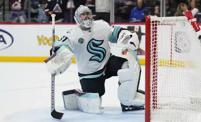 Seattle Kraken goaltender Philipp Grubauer (31) reacts after letting a goal slip past against the Colorado Avalanche during the third period of an NHL hockey game Tuesday, Nov. 5, 2024, in Denver. (AP Photo/Jack Dempsey)