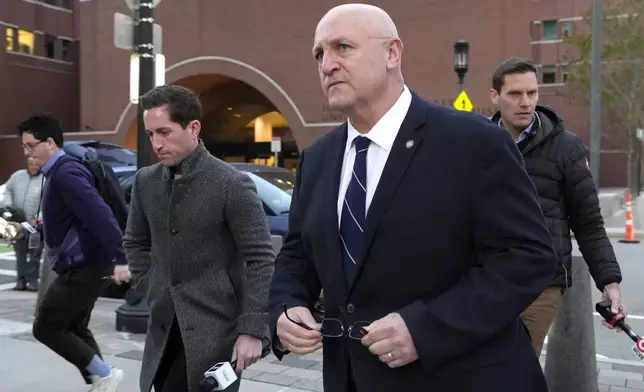 Thomas Dufault, center right, stepfather of Massachusetts Air National Guardsman Jack Teixeira, departs federal court, Tuesday, Nov. 12, 2024, in Boston, following a sentencing hearing for Jack Teixeira. (AP Photo/Steven Senne)