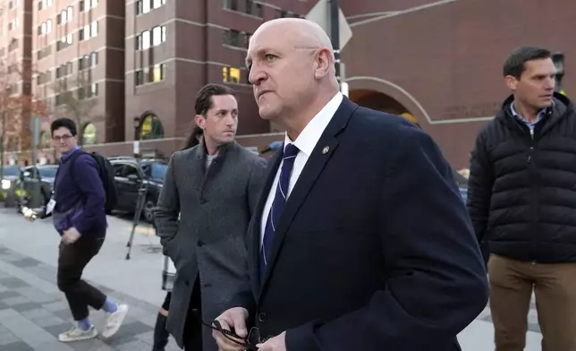 Thomas Dufault, front, stepfather of Massachusetts Air National Guardsman Jack Teixeira, departs federal court, Tuesday, Nov. 12, 2024, in Boston, following a sentencing hearing for Jack Teixeira. (AP Photo/Steven Senne)