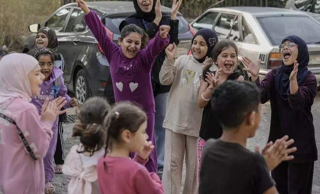 Displaced children take part in activities for mental healthcare, organized by the International Medical Corps, at a shelter housing them in Dekwaneh, east Beirut, Lebanon, Thursday, Nov. 7, 2024. (AP Photo/Bilal Hussein)