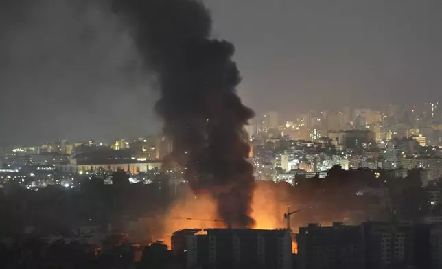 Flame and smoke rise from Israeli airstrikes on Dahiyeh, in the southern suburb of Beirut, Lebanon, early Friday, Nov. 1, 2024. (AP Photo/Hussein Malla)