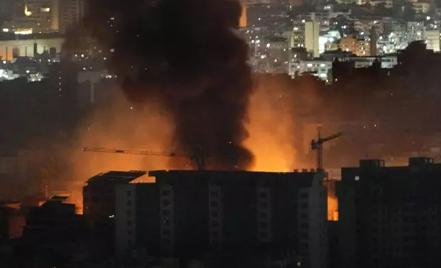 Flame and smoke rises from Israeli airstrikes on Dahiyeh, in the southern suburb of Beirut, Lebanon, early Friday, Nov. 1, 2024. (AP Photo/Hussein Malla)