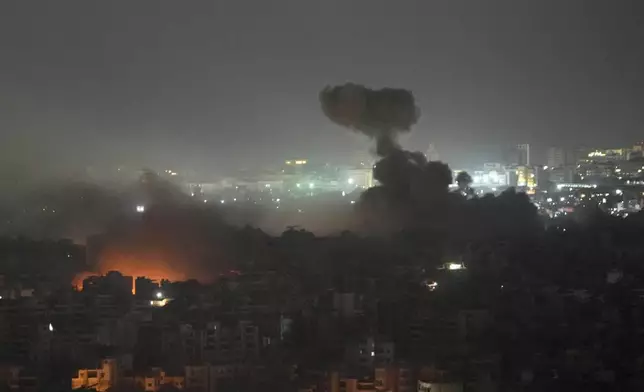 Flame and smoke rise from Israeli airstrikes on Dahiyeh, in the southern suburb of Beirut, Lebanon, early Friday, Nov. 1, 2024. (AP Photo/Hussein Malla)