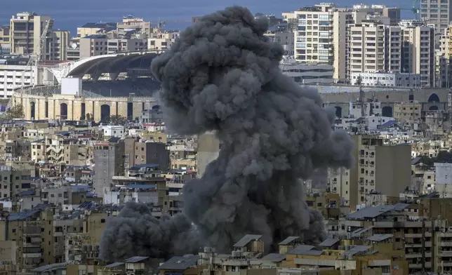 Smoke rises after an Israeli airstrike on Dahiyeh, in the southern suburb of Beirut, Lebanon, Wednesday, Nov. 13, 2024. (AP Photo/Hassan Ammar)