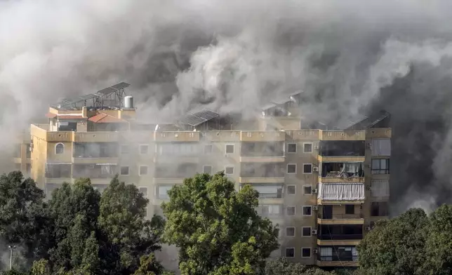 Smoke rises after an Israeli airstrike on Dahiyeh, in the southern suburb of Beirut, Lebanon, Tuesday, Nov. 12, 2024. (AP Photo/Bilal Hussein)