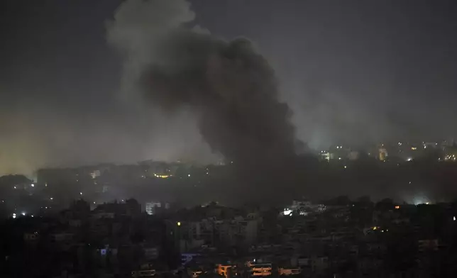 Smoke rises from Israeli airstrikes on Dahiyeh, in the southern suburb of Beirut, Lebanon, early Friday, Nov. 1, 2024. (AP Photo/Hussein Malla)