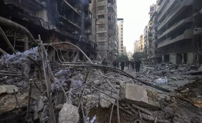 Journalists gather at the site of an Israeli airstrike in Dahiyeh, Beirut, Lebanon , Saturday, Nov. 9, 2024. (AP Photo/Hassan Ammar)