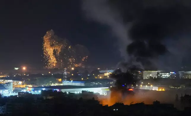 Smoke and fire rise from Israeli airstrikes in Dahiyeh, Beirut, Lebanon, Lebanon, Thursday, Nov. 7, 2024. (AP Photo/Hassan Ammar)