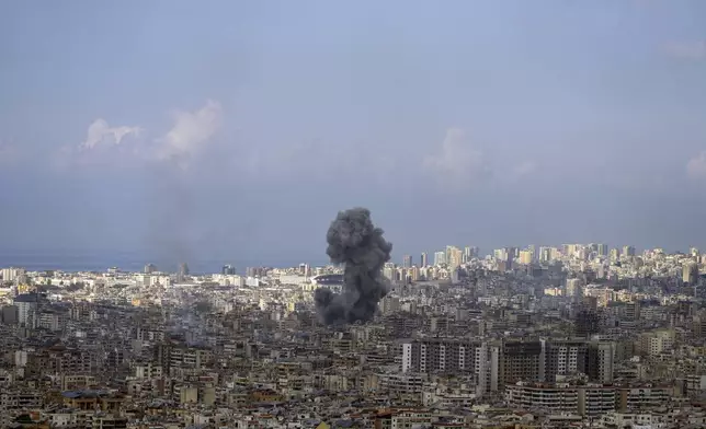 Smoke rises after an Israeli airstrike on Dahiyeh, in the southern suburb of Beirut, Lebanon, Wednesday, Nov. 13, 2024. (AP Photo/Hassan Ammar)