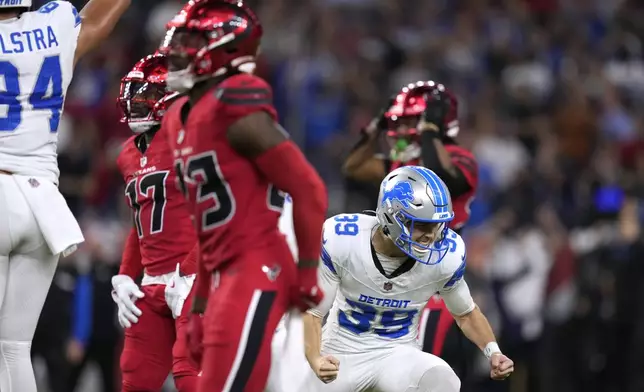 Detroit Lions place kicker Jake Bates (39) celebrates after kicking a 52-yard field goal at the end of an NFL football game against the Houston Texans, Sunday, Nov. 10, 2024, in Houston. The Lions won 26-23. (AP Photo/Eric Christian Smith)