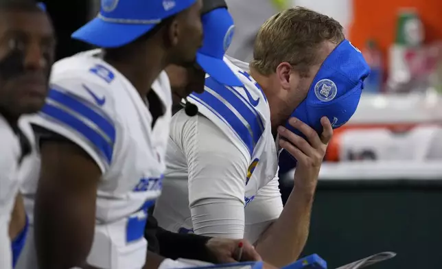 Detroit Lions quarterback Jared Goff reacts on the bench after throwing an interception during the second half of an NFL football game against the Houston Texans, Sunday, Nov. 10, 2024, in Houston. (AP Photo/David J. Phillip)