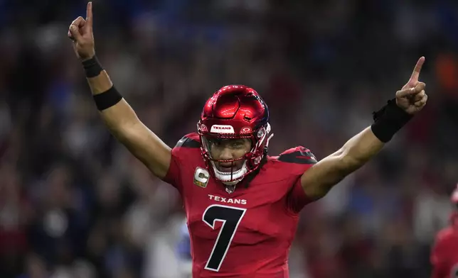 Houston Texans quarterback C.J. Stroud celebrates after throwing a touchdown pass during the first half of an NFL football game against the Detroit Lions, Sunday, Nov. 10, 2024, in Houston. (AP Photo/Eric Christian Smith)