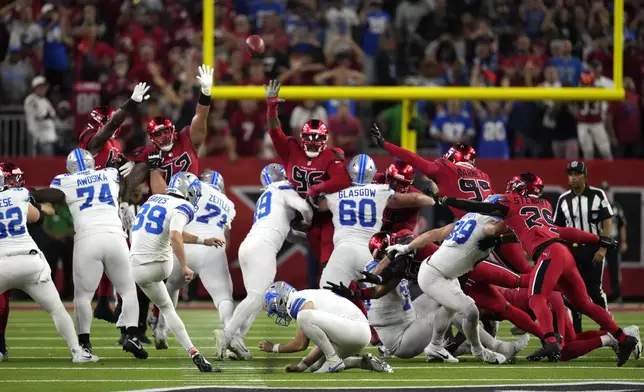 Detroit Lions place kicker Jake Bates (39) kicks a 52-yard field goal at the end of an NFL football game against the Houston Texans, Sunday, Nov. 10, 2024, in Houston. The Lions won 26-23. (AP Photo/David J. Phillip)