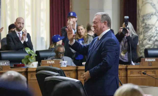 Former county Sheriff James McDonnell smiles as members of the Los Angeles City Council confirm him as Los Angeles Police Department Chief of Police at a meeting of the Council's public safety committee on Friday, Nov. 8, 2024, in Los Angeles. (AP Photo/Damian Dovarganes)