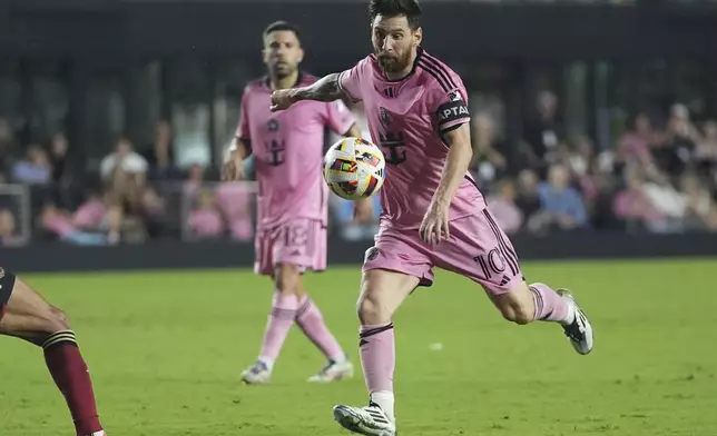 Inter Miami forward Lionel Messi (10) aims the ball during the second half of their MLS playoff opening round soccer match against Atlanta United, Saturday, Nov. 9, 2024, in Fort Lauderdale, Fla. (AP Photo/Lynne Sladky)