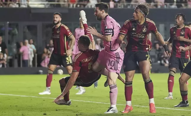 Inter Miami forward Lionel Messi (10) scores a goal during the second half of their MLS playoff opening round soccer match against Atlanta United, Saturday, Nov. 9, 2024, in Fort Lauderdale, Fla. (AP Photo/Lynne Sladky)