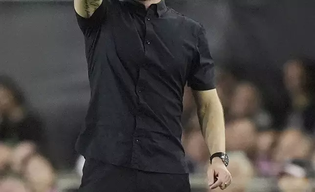 Atlanta United head coach Rob Valentino gestures during the first half of an MLS playoff opening round soccer match against Inter Miami, Saturday, Nov. 9, 2024, in Fort Lauderdale, Fla. (AP Photo/Rebecca Blackwell)