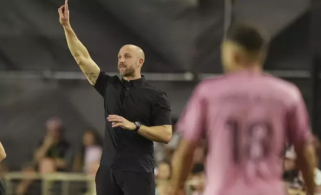 Atlanta United head coach Rob Valentino gestures during the first half of an MLS playoff opening round soccer match against Inter Miami, Saturday, Nov. 9, 2024, in Fort Lauderdale, Fla. (AP Photo/Rebecca Blackwell)