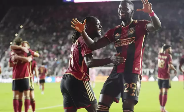 Atlanta United forward Jamal Thiaré (29) celebrates his goal during the first half of their MLS playoff opening round soccer match against Inter Miami, Saturday, Nov. 9, 2024, in Fort Lauderdale, Fla. (AP Photo/Lynne Sladky)